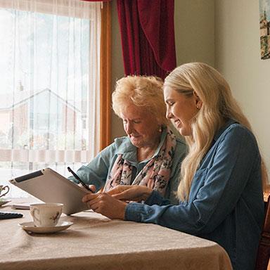 Older person receiving advice from carer