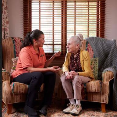 younger and older woman talking